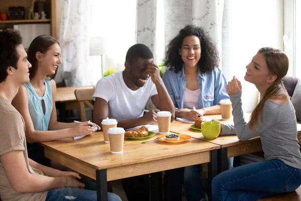 Five diverse students studying together in cafe during breakfast — Stock Photo, Image