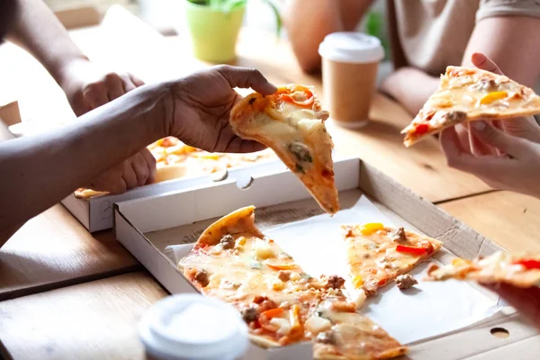 Close up people hands holds pieces of pizza — Stock Photo, Image