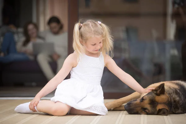 Little girl with big shepherd dog on terrace at home — Stock Photo, Image