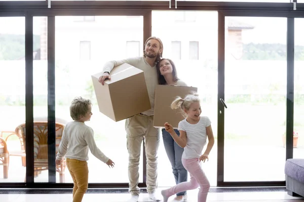 Young whole family moving at new house — Stock Photo, Image