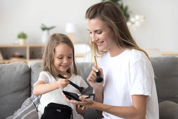 Happy mother and child having fun together enjoying doing makeup — Stock Photo, Image