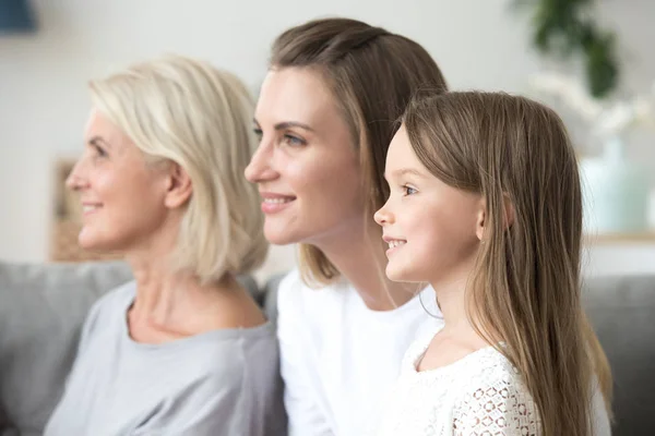 Smiling women in three generations family looking to bright futu