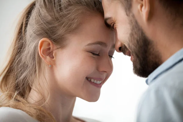 Close up of loving couple touching forehead enjoying tenderness — Stock Photo, Image