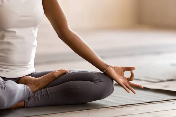 Yogi black woman practicing yoga lesson, doing Ardha Padmasana e — Stock Photo, Image