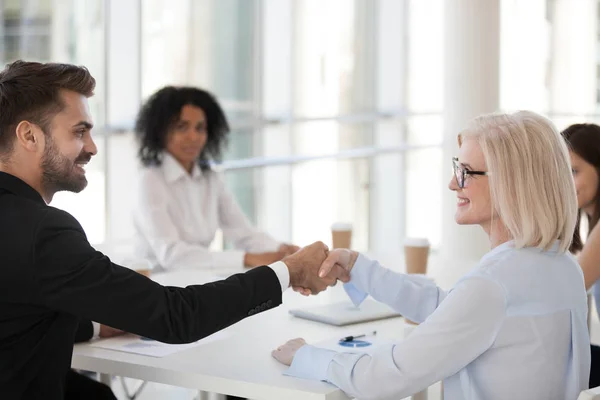 Smiling Mature Businesswoman Young Businessman Shaking Hands Greeting Introducing Meeting — Stock Photo, Image