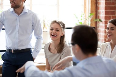 Happy laughing businesswoman at briefing, company meeting