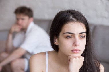 Frustrated woman looking in distance, thinking about relationshi clipart