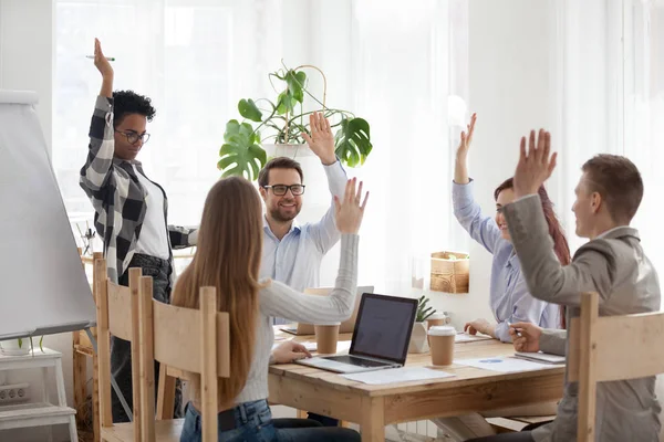 Diverse employees raise hands taking part in team building activ — Stock Photo, Image