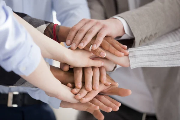 Close up of diverse people put hands in stack — Stock Photo, Image