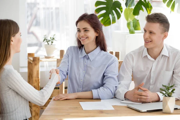 Smiling recruiter handshake female applicant at interview — Stock Photo, Image