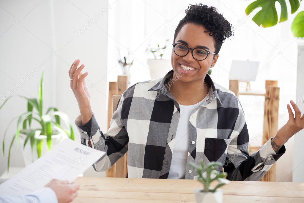 Happy black girl smile talking at office interview