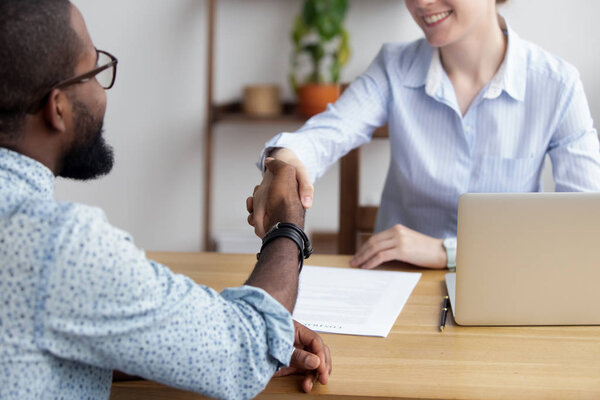 Diverse business people shaking hands greeting each other