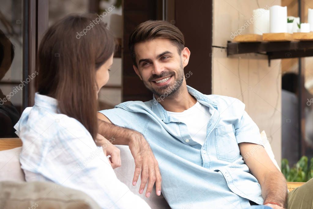 Happy smiling man having good conversation with young woman