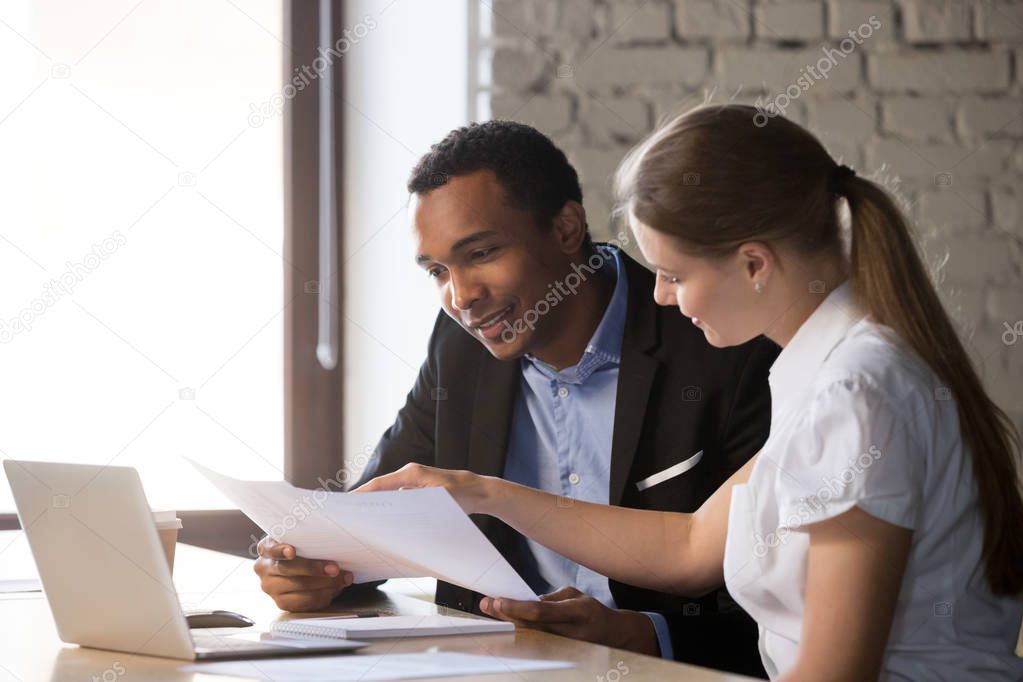 Female financial advisor insurer consulting male african-america