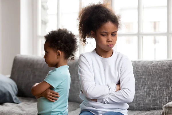 Angry stubborn african sister and offended brother ignoring each — Stock Photo, Image