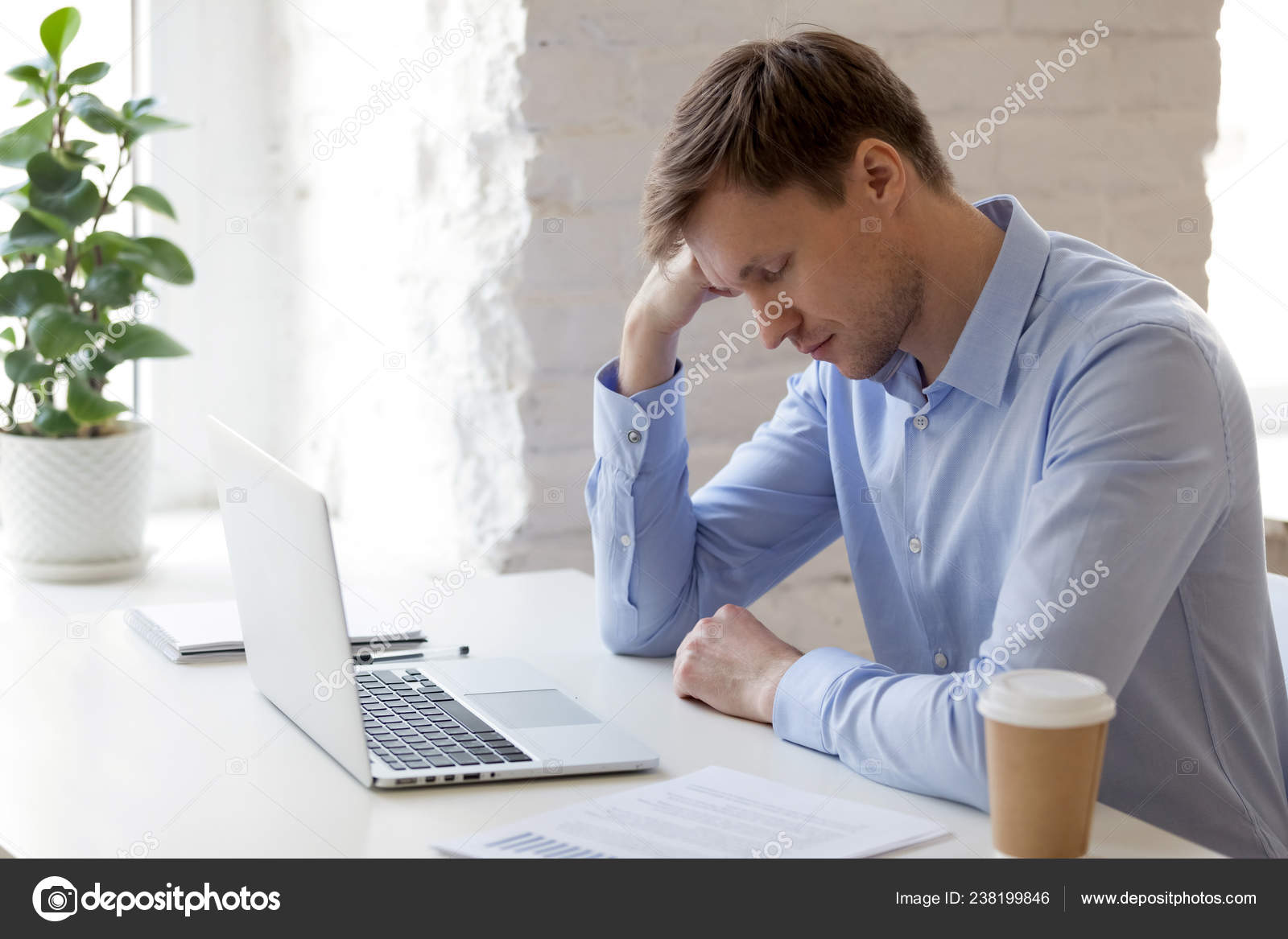 Tired Sleepy Businessman Sitting With Closed Eyes At Workplace