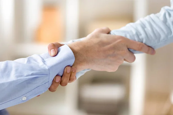 Close up man and woman holding each other wrists, support concep — Stock Photo, Image