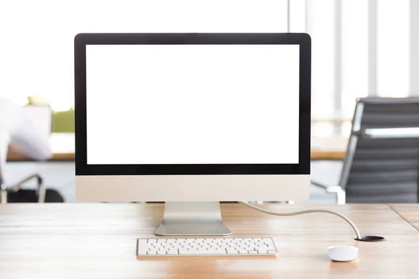 Mock up monitor computer screen with keyboard on office desk — Stock Photo, Image