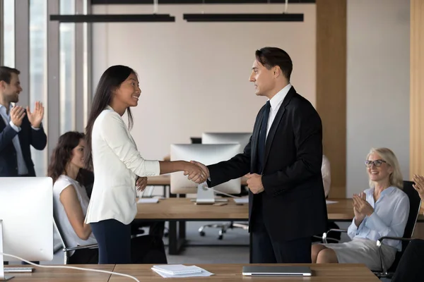 Boss shaking hand of asian employee congratulating worker with promotion — Stock Photo, Image