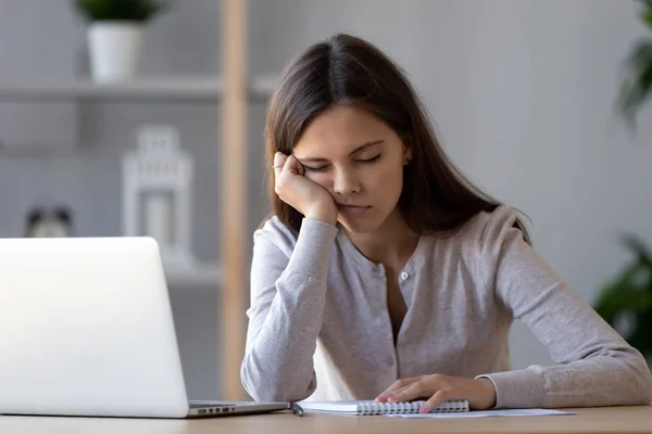 Bored funny woman resting on hand sleeping at workplace — Stock Photo, Image