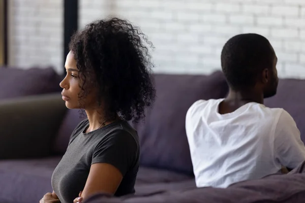 Sad unhappy african wife avoiding talk ignoring husband after fight — Stock Photo, Image