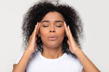 Nervous african woman breathing calming down trying to relieve stress clipart