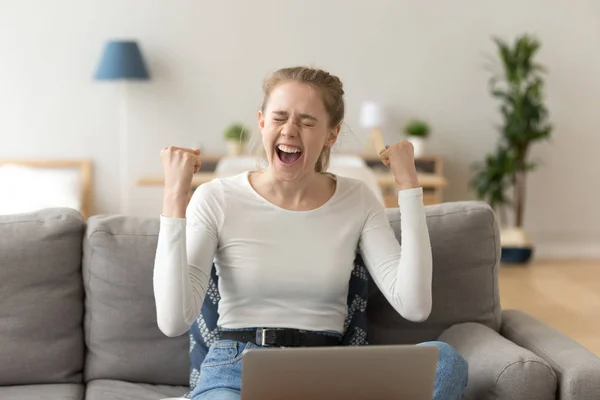 Happy girl celebrating victory excited by online win feeling winner — Stock Photo, Image