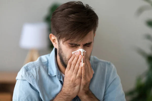 Sick man got flu allergy sneezing in handkerchief blowing nose — Stock Photo, Image