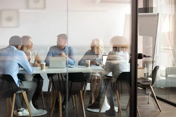 Business people negotiating at boardroom behind closed doors — Stock Photo, Image