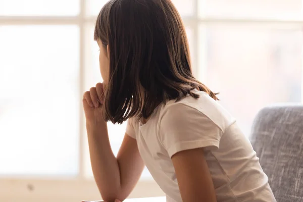 Sad thoughtful little girl feeling hurt depressed bored looking away — Stock Photo, Image