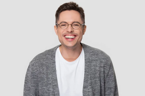 Funny happy millennial man wearing glasses laughing looking at camera — Stock Photo, Image