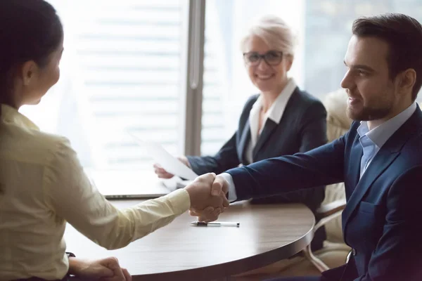 Happy hr manager hiring successful candidate at job interview — Stock Photo, Image