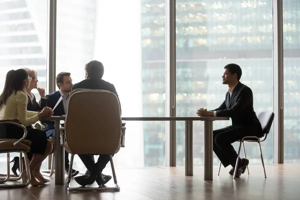 Team Interviewing African Male Candidate Sitting Big Table Modern Office — Stock Photo, Image