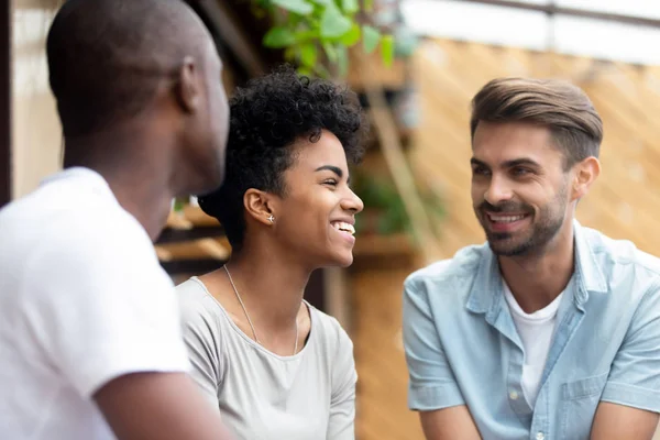 Mixed race female spending time with male friends — Stock Photo, Image