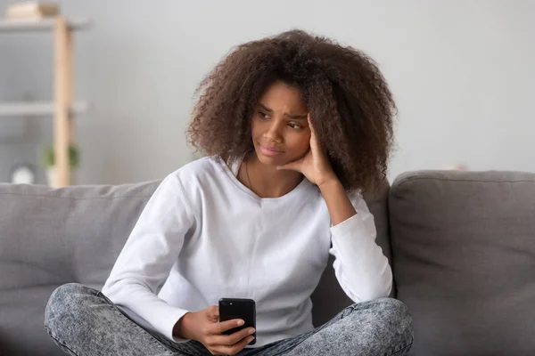 Frustrated mixed race teen girl received unpleasant message — Stock Photo, Image