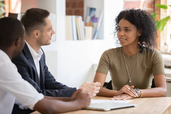 Confident african female applicant talking to diverse hr managers — Stock Photo, Image