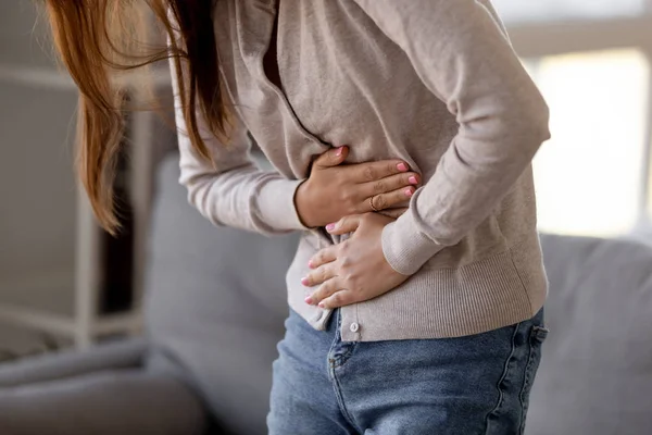 Close up woman holding belly, feeling pain, health problem concept — Stock Photo, Image