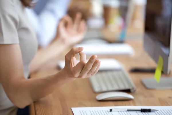 Female doing yoga during working day in office — Stock Photo, Image