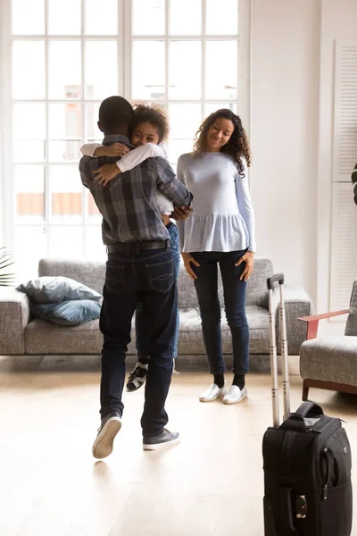 Happy black family excited reuniting with father at home — Stock Photo, Image