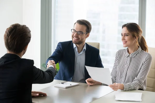Happy hr manager handshaking hiring successful male job candidate — Stock Photo, Image