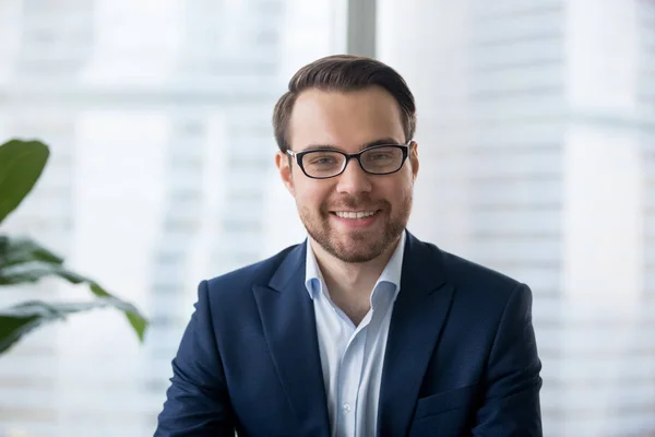 Businessman in suit looking at camera making conference video call — Stock Photo, Image