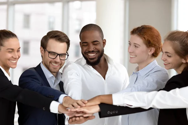 Diverse business people group put hands together in stack pile — Stock Photo, Image