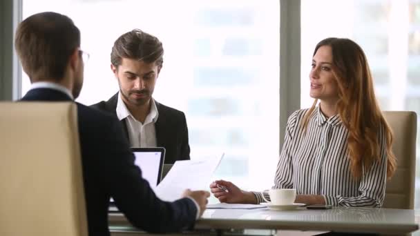 Business people negotiating under contract at formal group meeting — Stock Video
