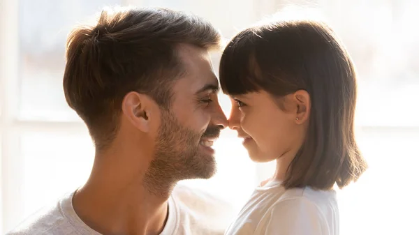 Faces loving father and adorable daughter touching noses — Stock Photo, Image