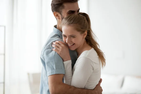 Happy excited couple in love embracing, having fun together — Stock Photo, Image