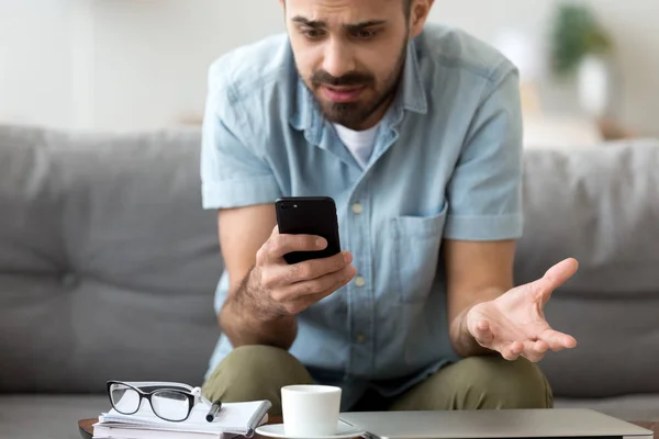 Close up confused man having problem with phone, receive bad news — Stock Photo, Image