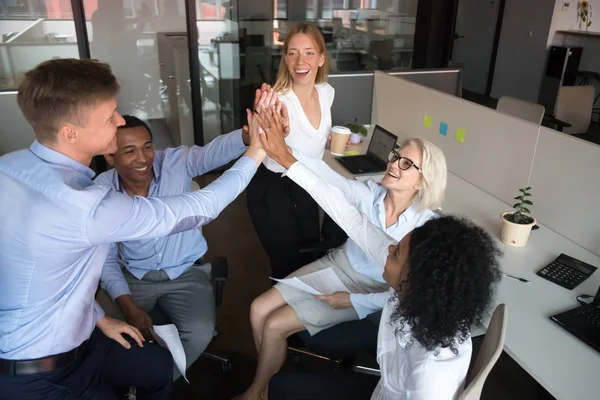 Happy diverse team workers group of businesspeople give high five — Stock Photo, Image