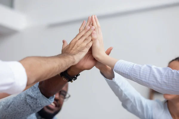 Multi ethnic business team give high five together, close up — Stock Photo, Image
