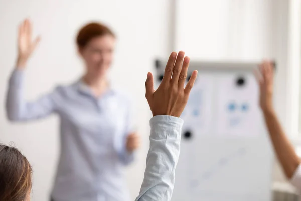 Business people raise hands up engaged in voting at conference — Stock Photo, Image