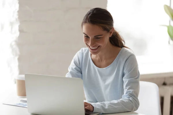 Attractive woman smile chatting online at desk — Stock Photo, Image